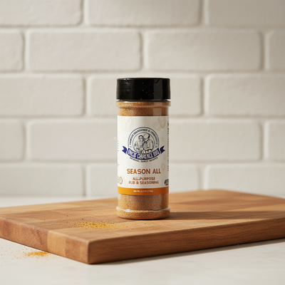 Spice jar labeled 'Season All' on a wooden cutting board with a white tiled wall background