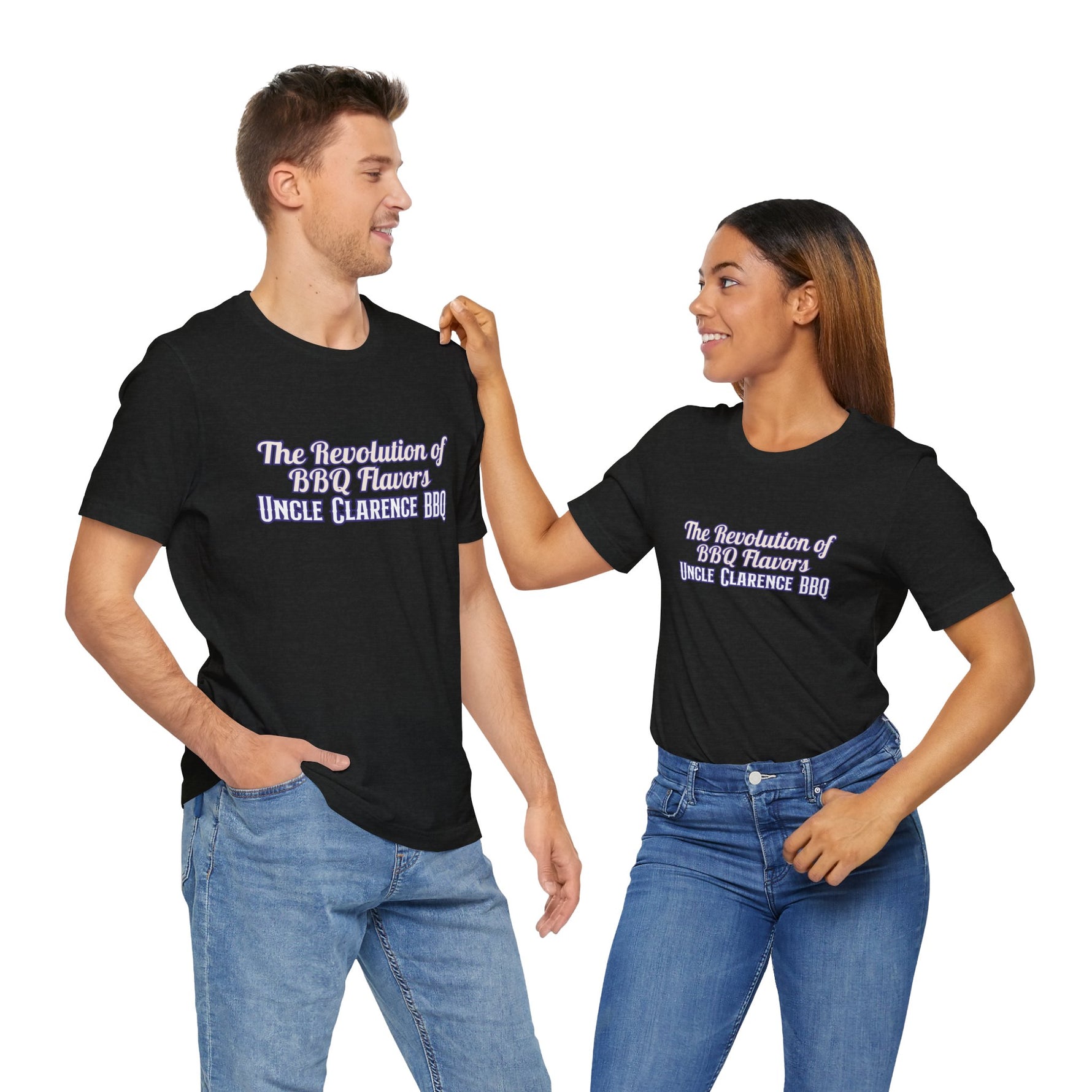 Couple wearing Revolution BBQ flavors t-shirt in black featuring bold text design for BBQ enthusiasts