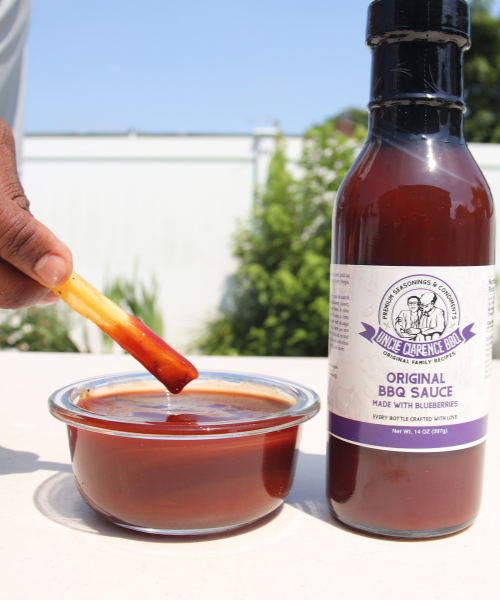 Uncle Clarence Bells Original BBQ Sauce bottle and dip bowl with fry dipped in sauce unique barbecue sauce gift